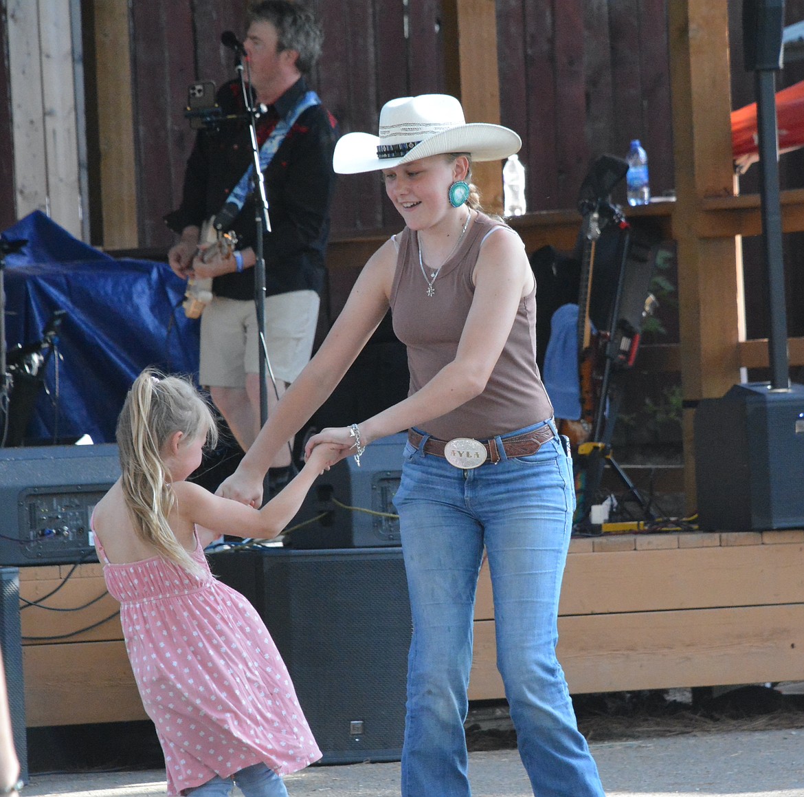 Ayla Henderson danced to some music before the rodeo on Saturday. (Mineral Independent/Amy Quinlivan)