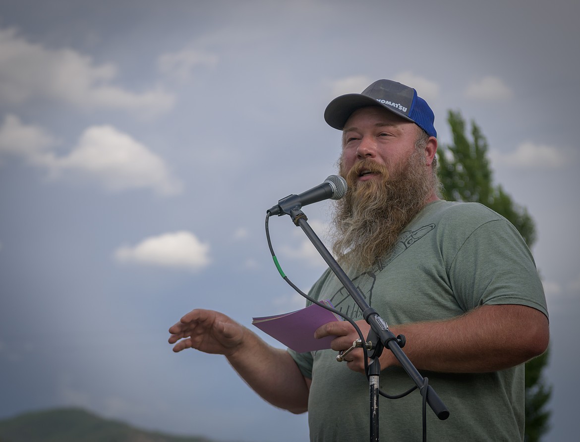 Studs Building and Home owner Joel Collett conducts the auction during the Splash N Bash event to raise money for playground equipment. (Tracy Scott/Valley Press)