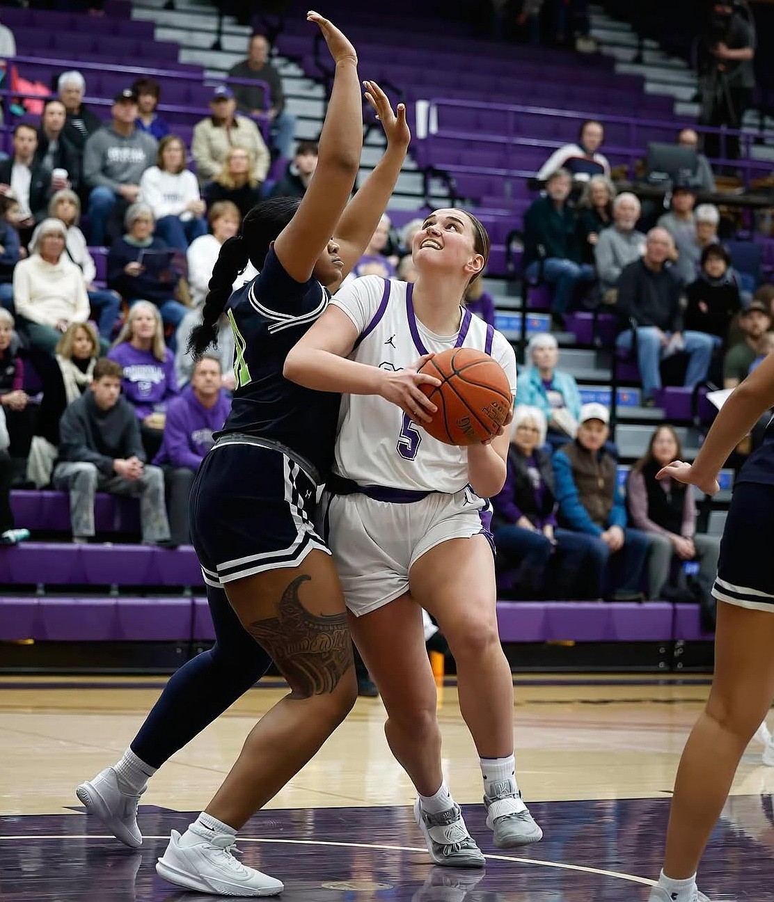 Fighting Saints forward Meagan Karstetter drives to the basket during a game last season. Karstetter is eager to take on a bigger role with the team in her final season at Carroll College.