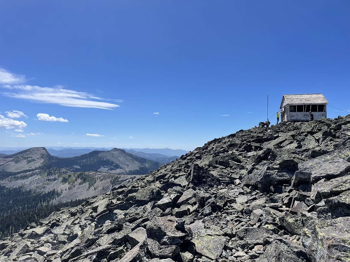 Volunteers make repairs to Northwest Peak Lookout on July 25, 2025. (Hailey Smalley/Daily Inter Lake)