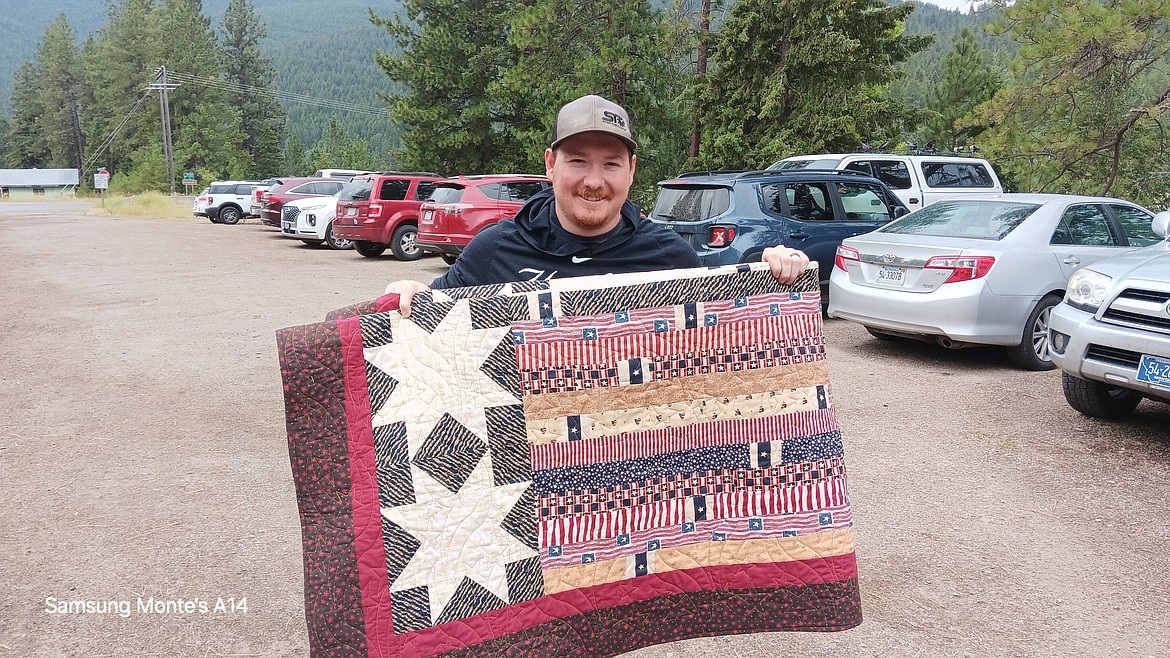 Cody Stipcich and his family attended the Post 13 Potluck, quilt presentation and Superior Meats Raffle drawing. The Cabin Fever Quilters Guild wants every military veteran in Mineral County to have a quilt they made as their way of saying, “Thank You for your Service." (Monte Turner/Mineral Independent)