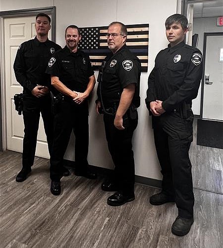 The full Soap Lake Police Department. From left to right are Soap Lake Police officers Mikal Bias, Robert Geates, Chief Patrick Canady and officer Yuriy Bezzubenko. Soap Lake PD has one officer in the police academy, Tyler Smith, who will be joining the department soon.