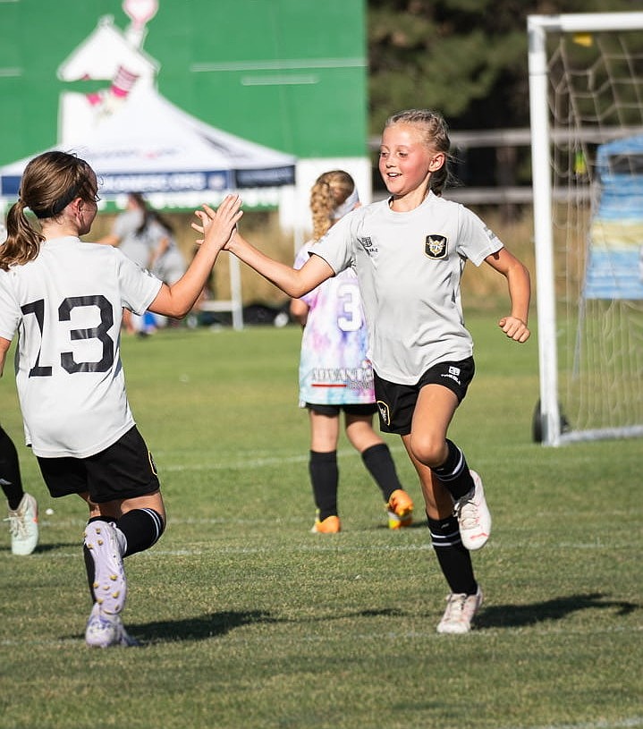 Courtesy photo
The Sting U10 girls soccer team competed at the Northwest Cup last weekend at the Spokane Polo Fields. After winning its group to advance to the semifinals, the Sting faced Spokane Shadow Academy in a thrilling match. Regulation ended in a 2-2 tie, sending the game to penalty kicks. The shootout went eight rounds before the Sting narrowly fell. Pictured is Rya Verlanic (13) and Brystol Hayes of the Sting.