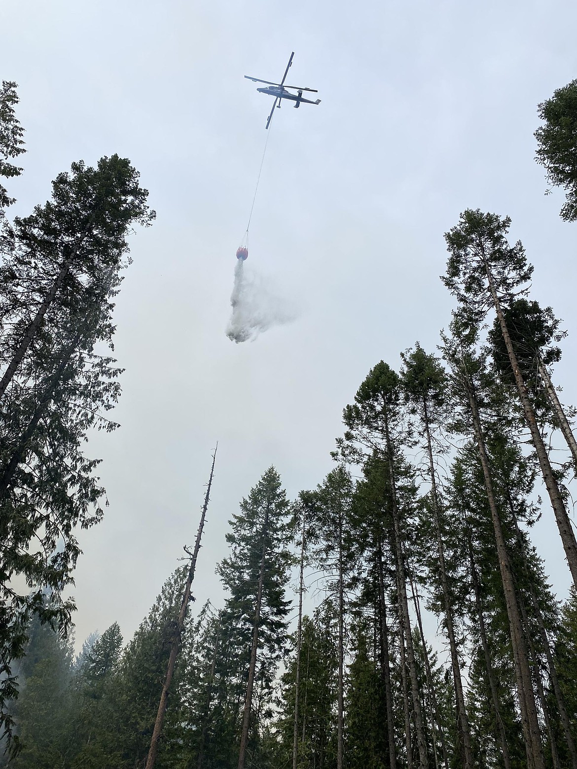 A water drop on the Hope Fire on July 19. The fire is sitting at around 8,200 acres and is 95% contained as of Thursday. The blaze started on July 8 and is located near Kettle Falls.