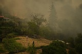 At least 3 dead and thousands displaced as wildfires rage across southern Europe