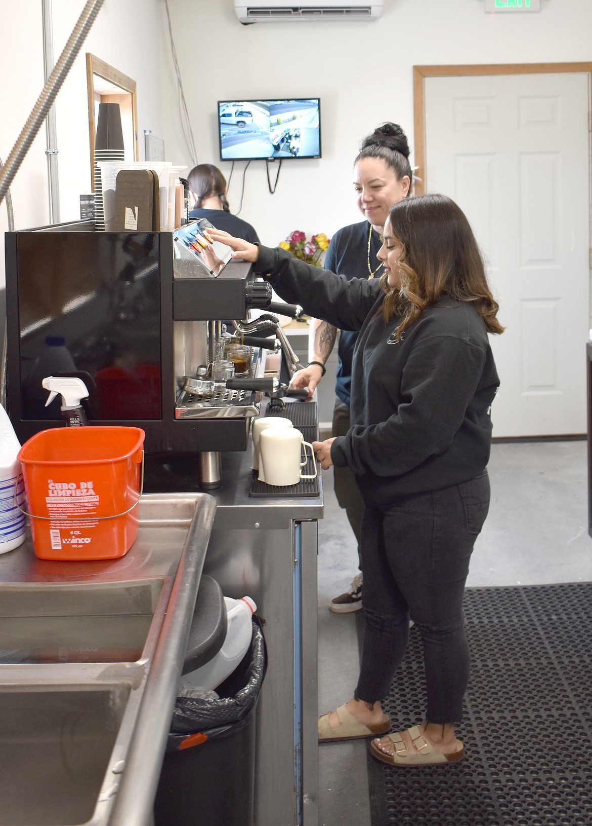 Caffeine Fix co-owner Danae Mendez mixes a coffee drink for a customer Thursday. The shop uses Conversatio coffee, roasted in Othello.