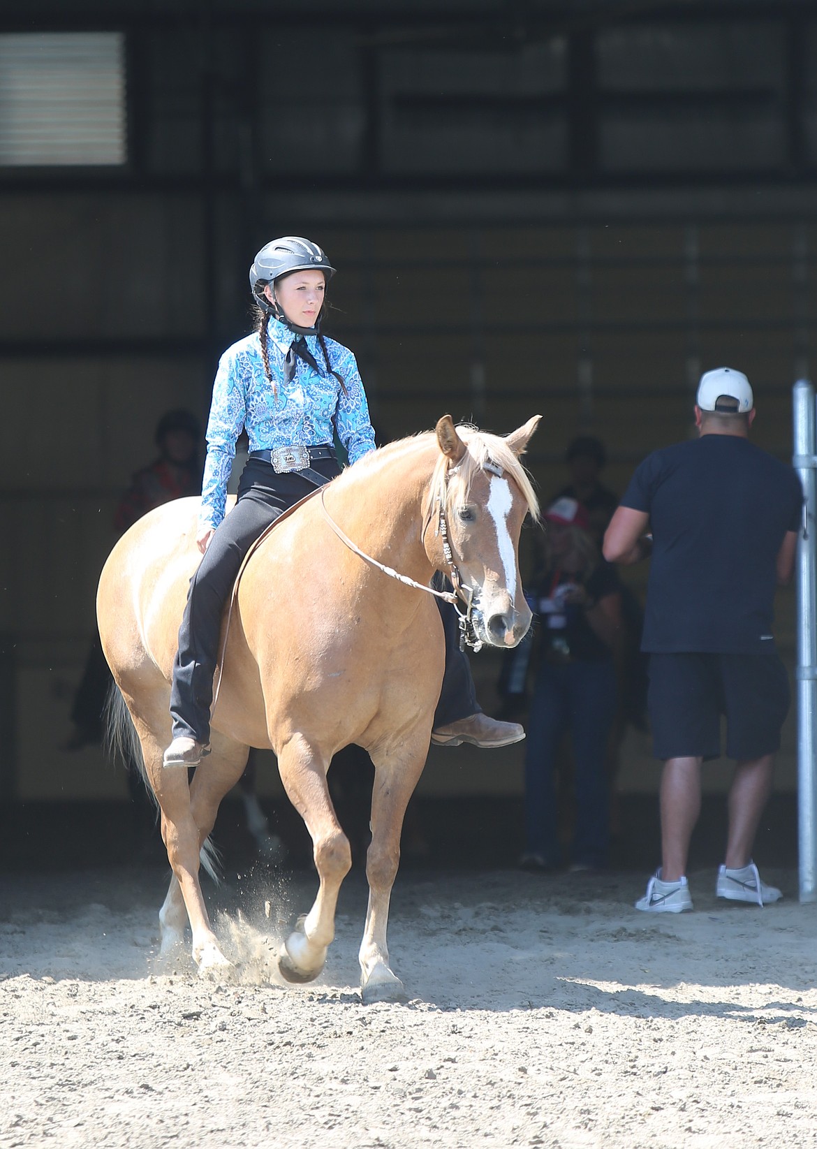 A GCYEP rider exits the Harwood Pavillion after competing in the bareback competition at the Grant County Fair. Riders demonstrated their abilities to give commands by changing the speed and direction of their horses throughout the arena.
