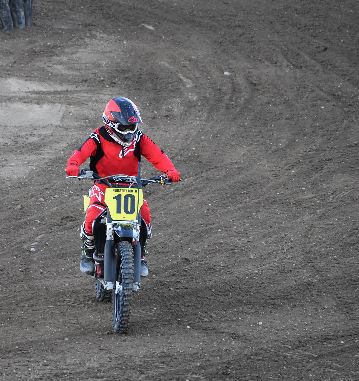 Dan Staley makes his way out of the arena after taking first in the dirt bike race Tuesday evening.