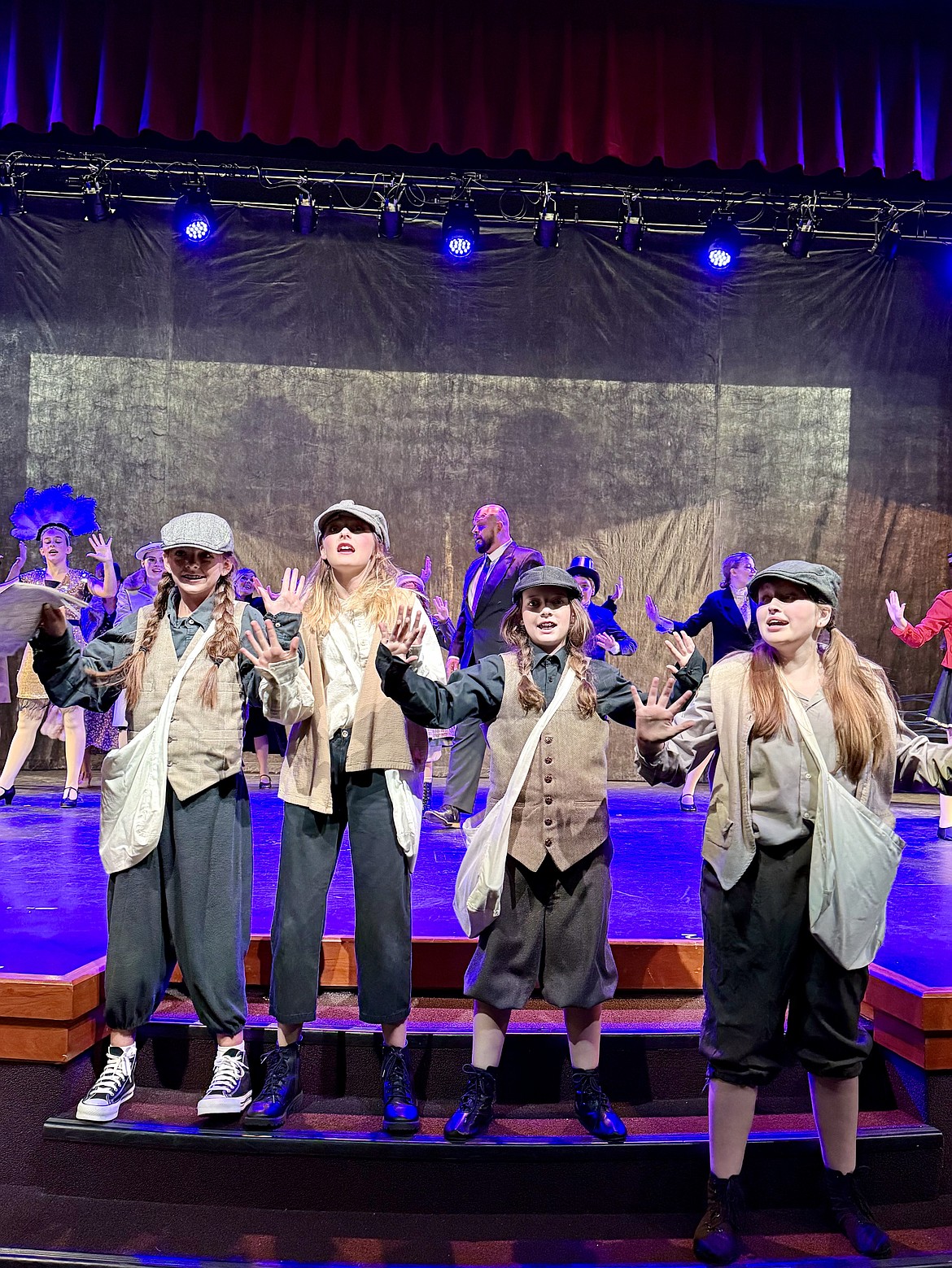 From left, Evangeline Earley, Navy Lauri, Blakelee Griffitts and Lilly Chase perform during a rehearsal for the CYT North Idaho production of "Annie."