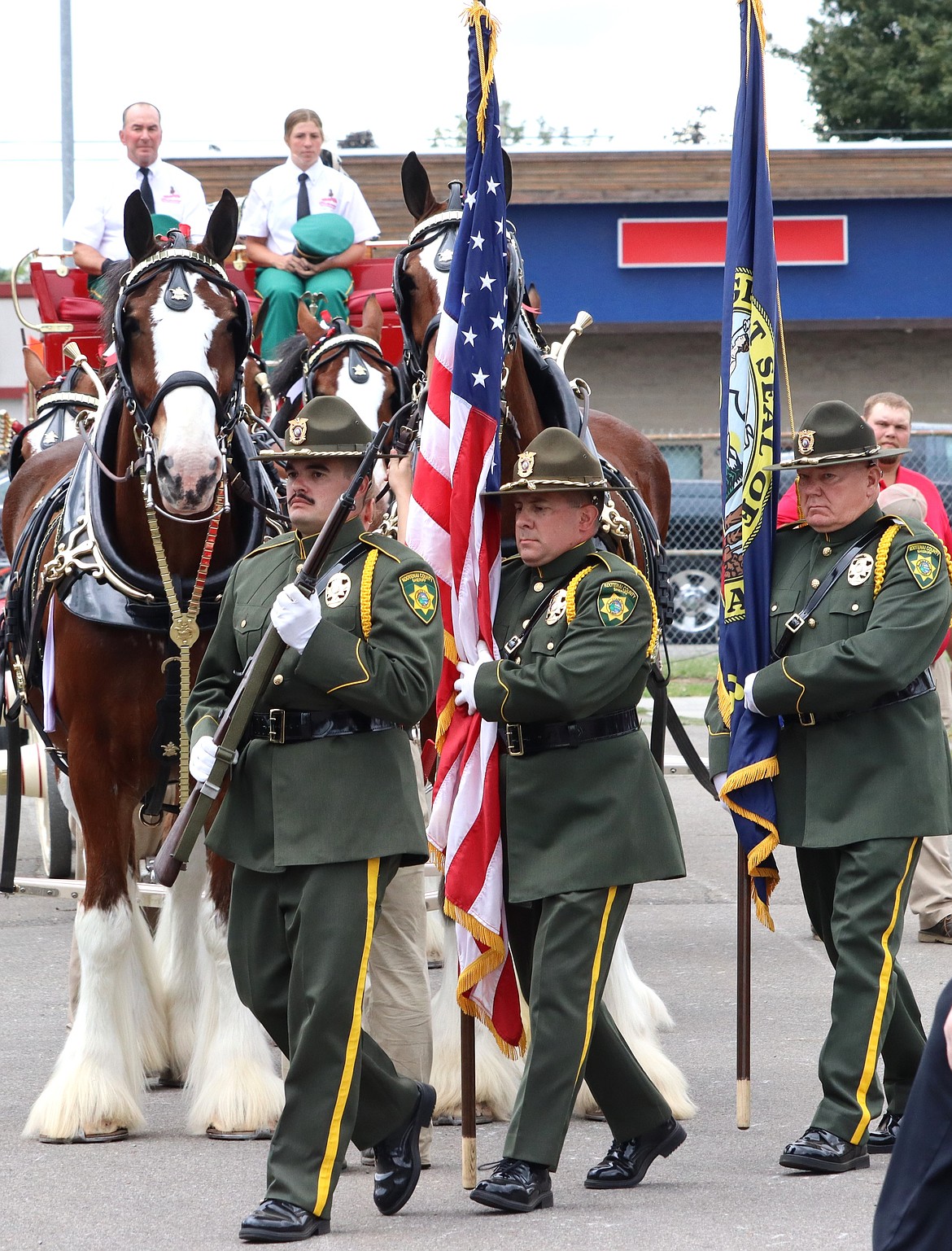 The Color Guard walks in front of the Budweiser Clydesdales on Friday during opening ceremonies at the North Idaho State Fair.