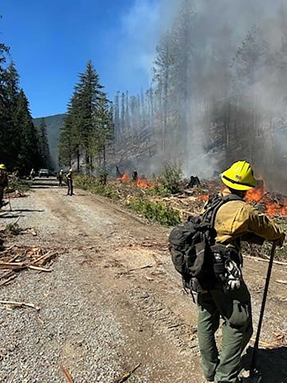 Firefighters are pictured working on a fireline at the Lightning Creek Fire in southeastern Bonner County.