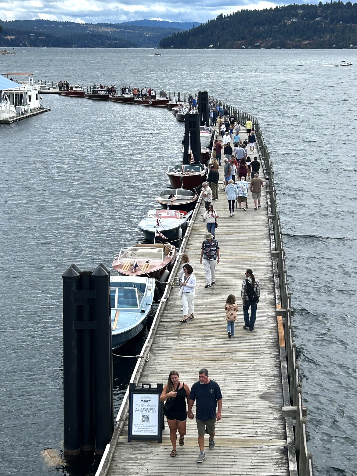 People walk on The Boardwalk during Saturday's Antique and Classic Boat Festival.