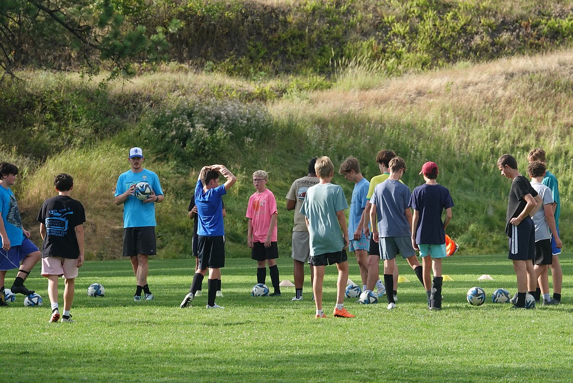 Thompson Falls-Plains-St. Regis head boys soccer coach Michael Scharfe (third from left) meets with his team during practice in Thompson Falls Friday. ( John Hamilton/VP-MI)