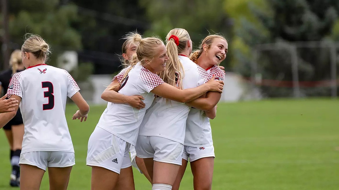 Eagles women’s soccer players celebrate a successful play together against Southern Utah. The Eagles secured their first win of the season after beating the Thunderbirds 2-1.