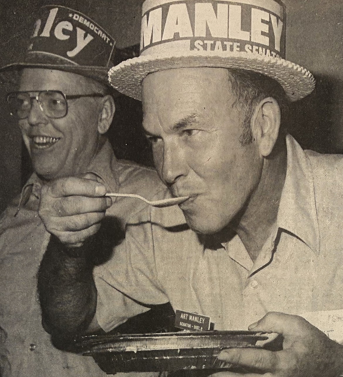Art Manley eats a huckleberry pie during a fundraiser in 1980.