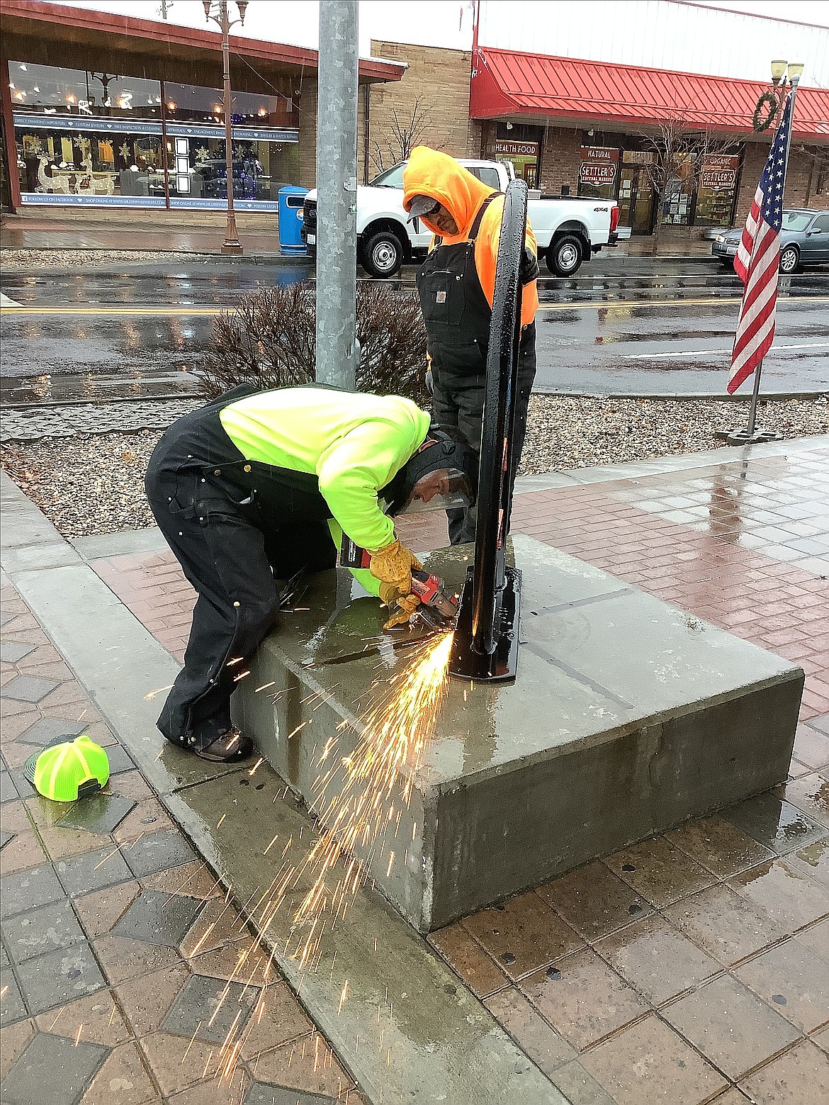 City workers remove statues from pedestals in downtowm Moses Lake last December so the artwork could be sent for refurbishment. Many of them have been re-installed, but a few were also moved to new locations more appropriate to their themes.