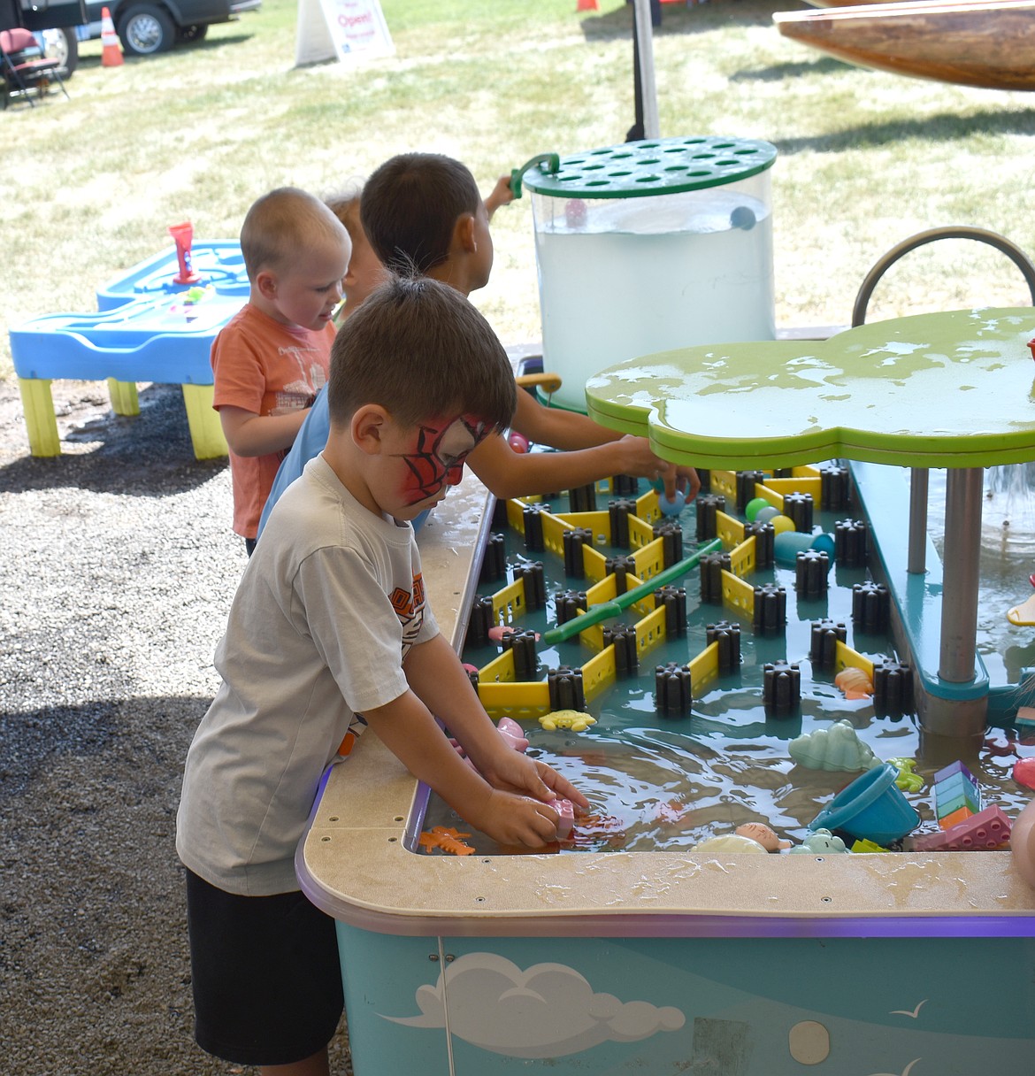 Children explore all the things you can do with water at the Waterpalooza exhibit at the Grant County Fair.