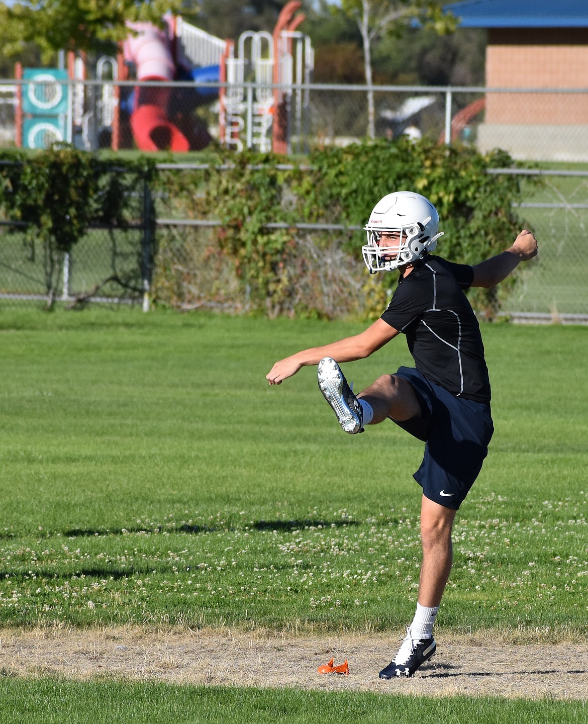 A player for Moses Lake Christian Academy/Covenant School works on his punting during practice. The Lions will be heading into their fourth season as a football program this fall.