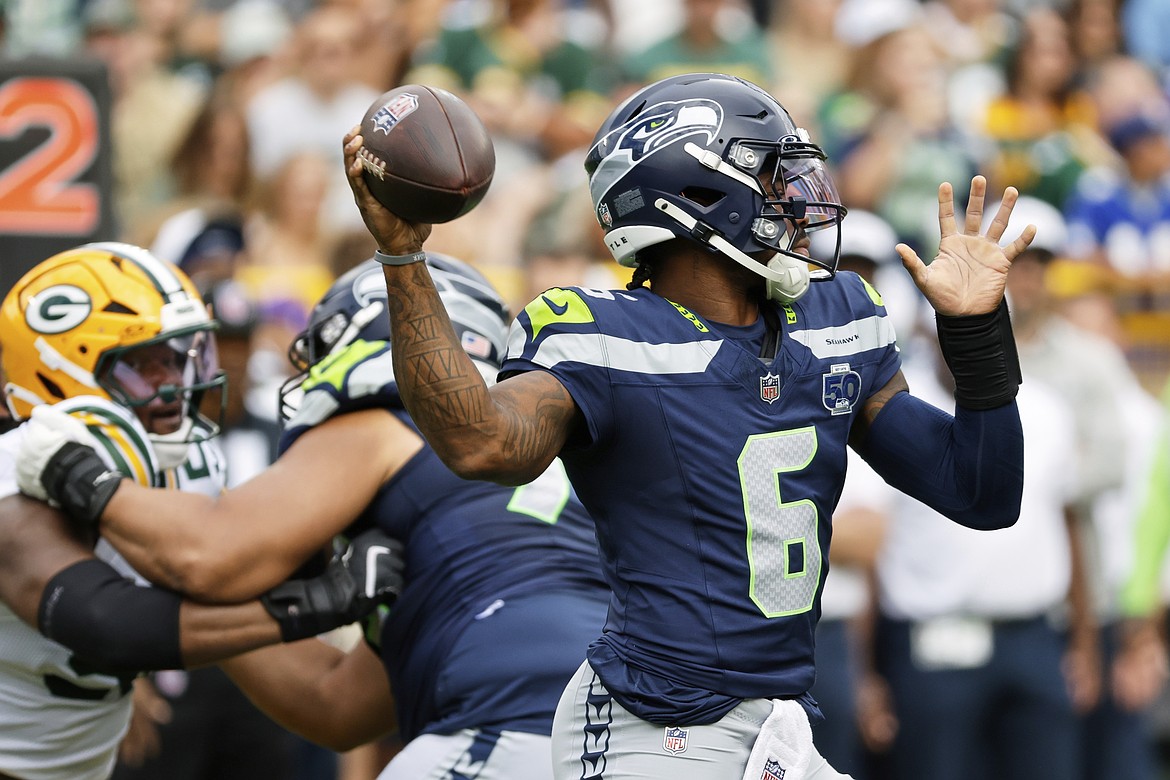 Seattle Seahawks' Jalen Milroe thorws during the first half of a preseason NFL football game against the Green Bay Packers Saturday, Aug. 23, 2025, in Green Bay, Wis.