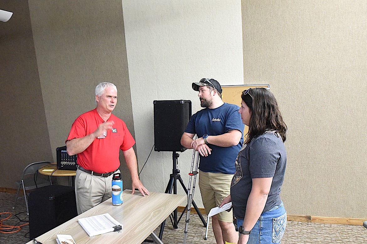 Libby historian and author Jeff Gruber speaks to some attendees at Libby Dam Saturday, Aug. 23, 2025, during the 50th anniversary ceremony. (Scott Shindledecker/The Western News)