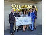 Coldwell Banker Schneidmiller Realty donates $25K to Canopy Village