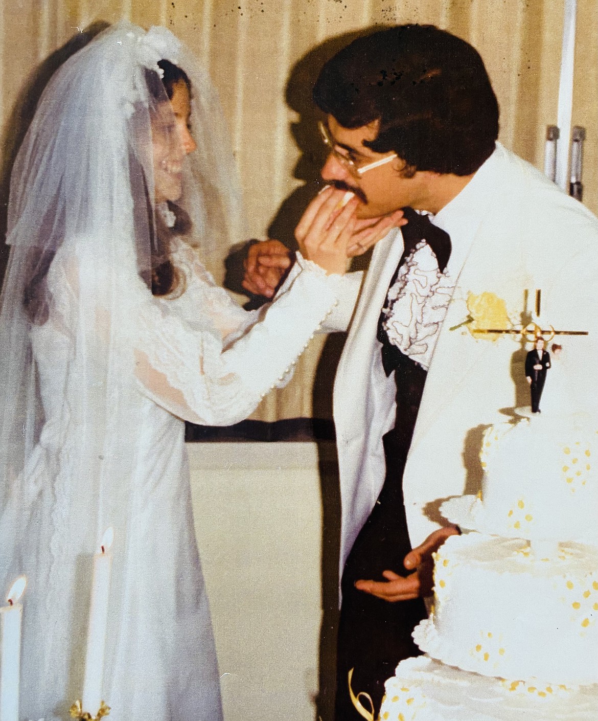 Brenda Oliveria feeds cake to husband Dave on their wedding day June 21, 1975.