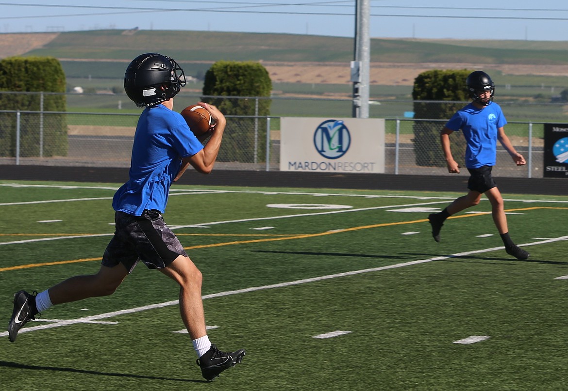 Knights receiver Shea Stevenson hauls in a pass during a practice. Stevenson said he is confident in his teammates' potential to make another run at a state title this season.