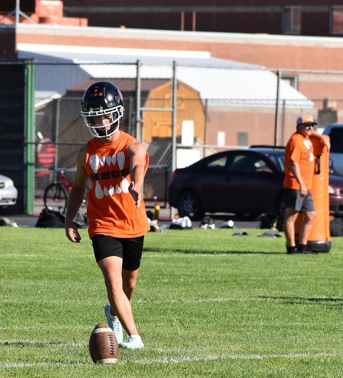 Tigers kicker Caleb Moberg prepares to do a short kick during practice. The Tigers are looking to be senior-heavy this season, with around 20 seniors set to play on the team this fall.