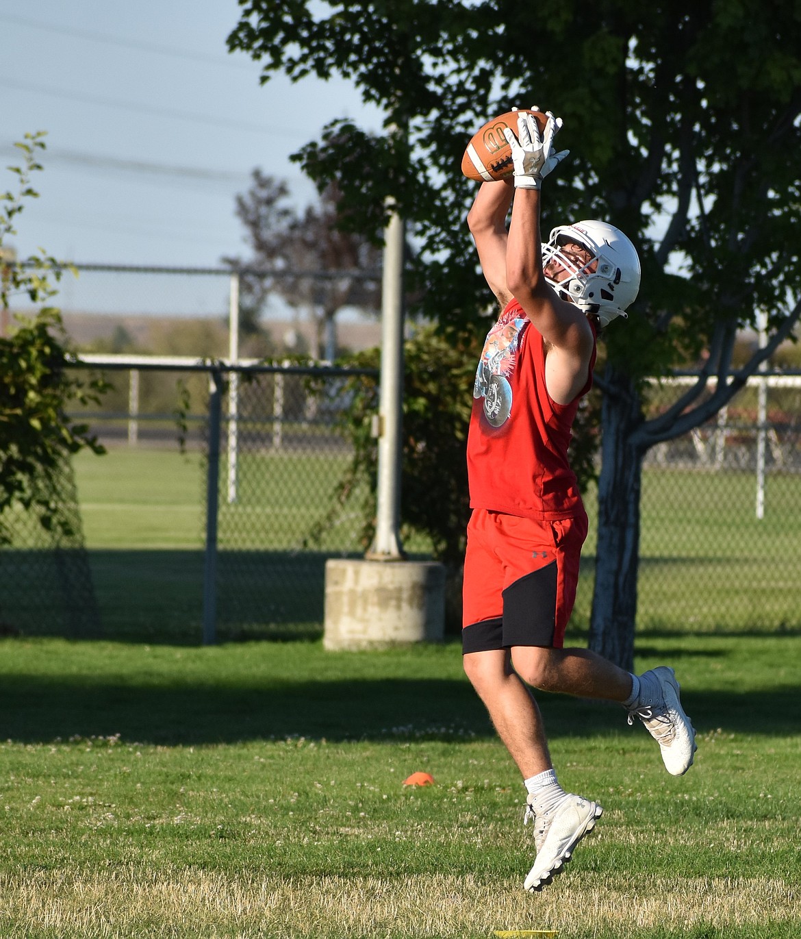 Derick Smith jumps up to make a catch during a receiver drill at practice. Smith said he is excited to see what the team can do with the increased depth on the roster this season.