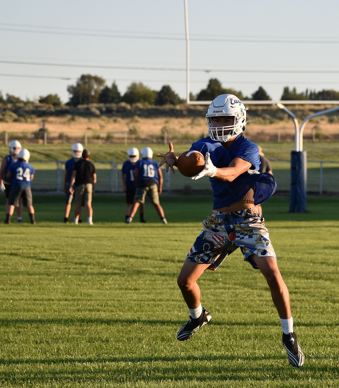 A Soap Lake Eagle hops in the air to complete a catch during practice. Coach Devine said the focus on offense this season will be to have better control of the ball.
