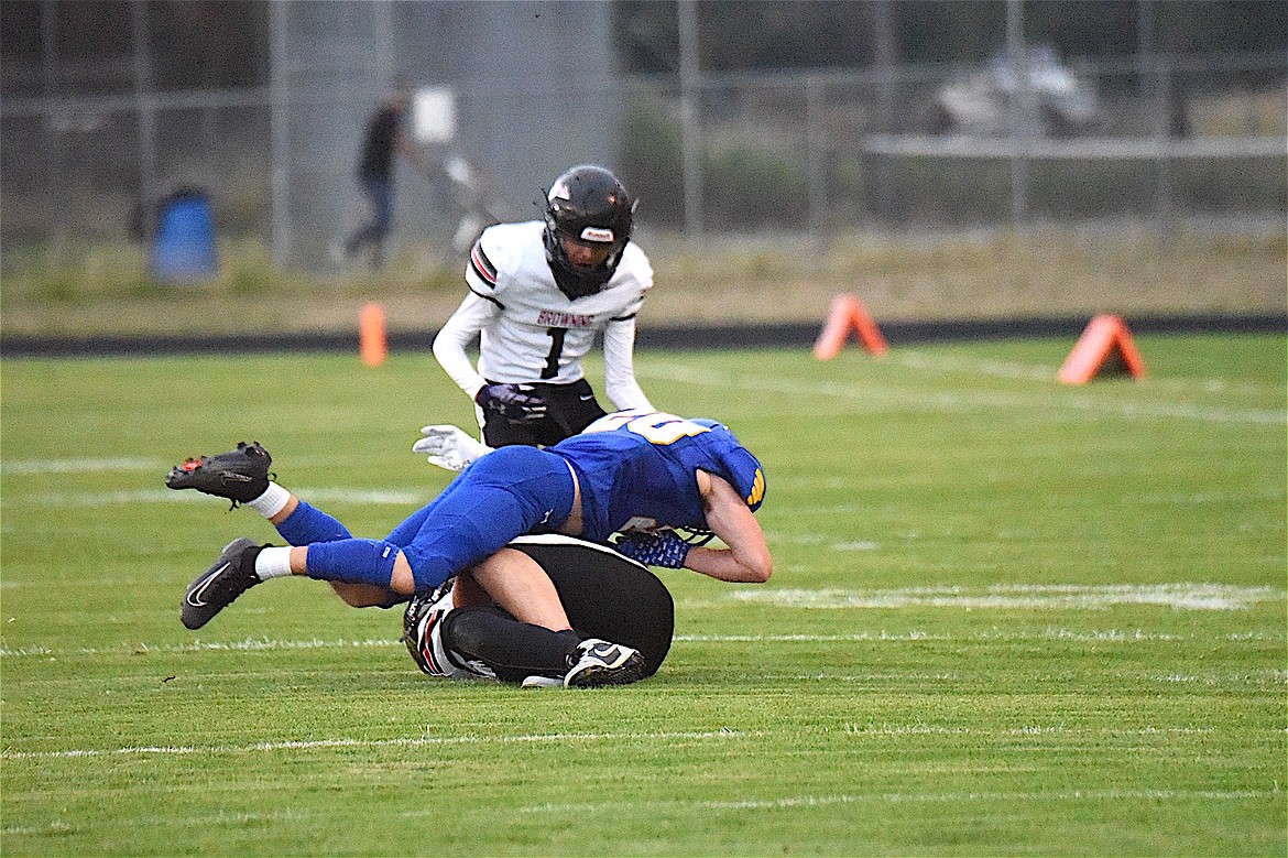 Libby Loggers linebacker Bransen Holzer levels a Browning player after a pass reception during the game Friday, Aug. 29, 2025. Holzer had three big plays on offense, defense and special teams to set up Libby touchdowns. (Scott Shindledecker/The Western News)