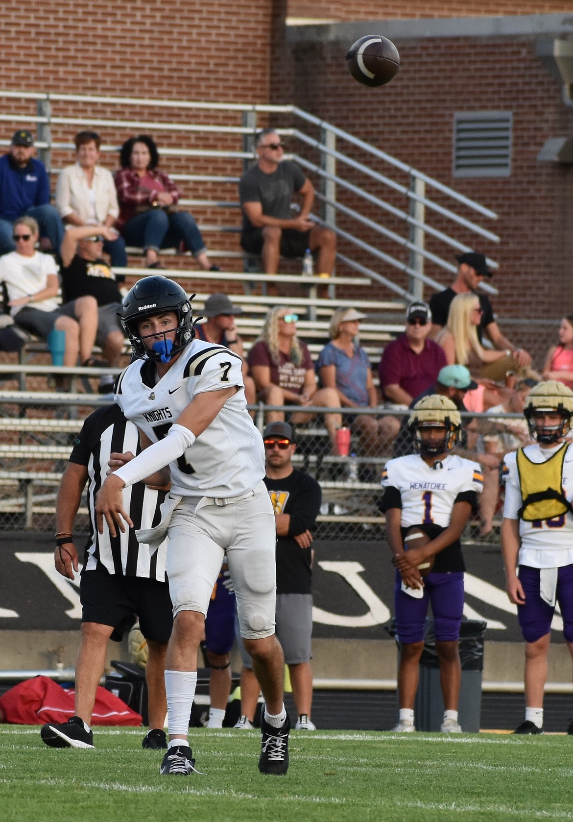 Knights’ quarterback Grant Wardenarr throws the ball to an open teammate during the varsity team’s second jamboree matchup.