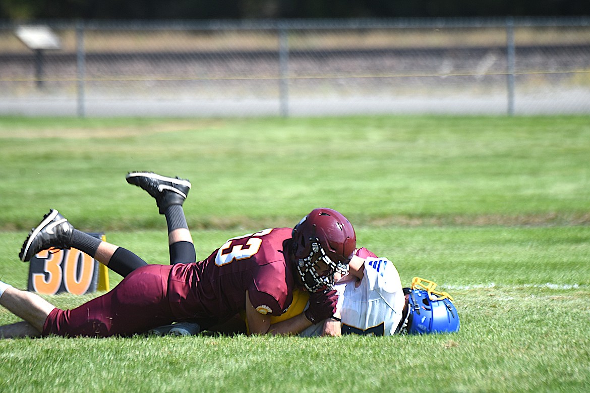 Troy junior defensive lineman Braxton Pinnard tackles a Victor ball carrier during a game Saturday, Aug. 30, 2025. (Scott Shindledecker/The Western News)