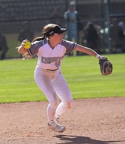 Ciarrah Knoll winds up a pass to first base during a game for the Wenatchee Valley Knights. Knoll said she hopes to find her way into a coaching gig someday.