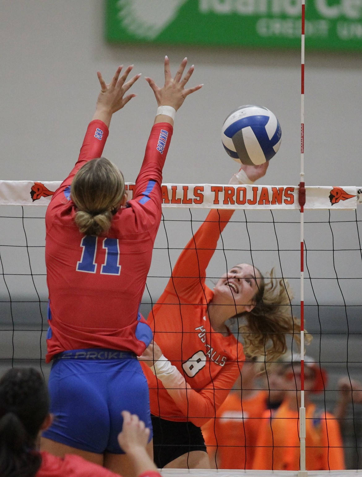 MARK NELKE/Press
Post Falls sophomore Zuri Blood (8) hits past Coeur d'Alene senior Gianna Callari (11) on Tuesday night at The Arena at Post Falls.