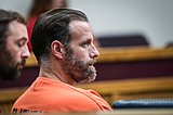 Motorist accused of running down a man pleads not guilty to deliberate homicide