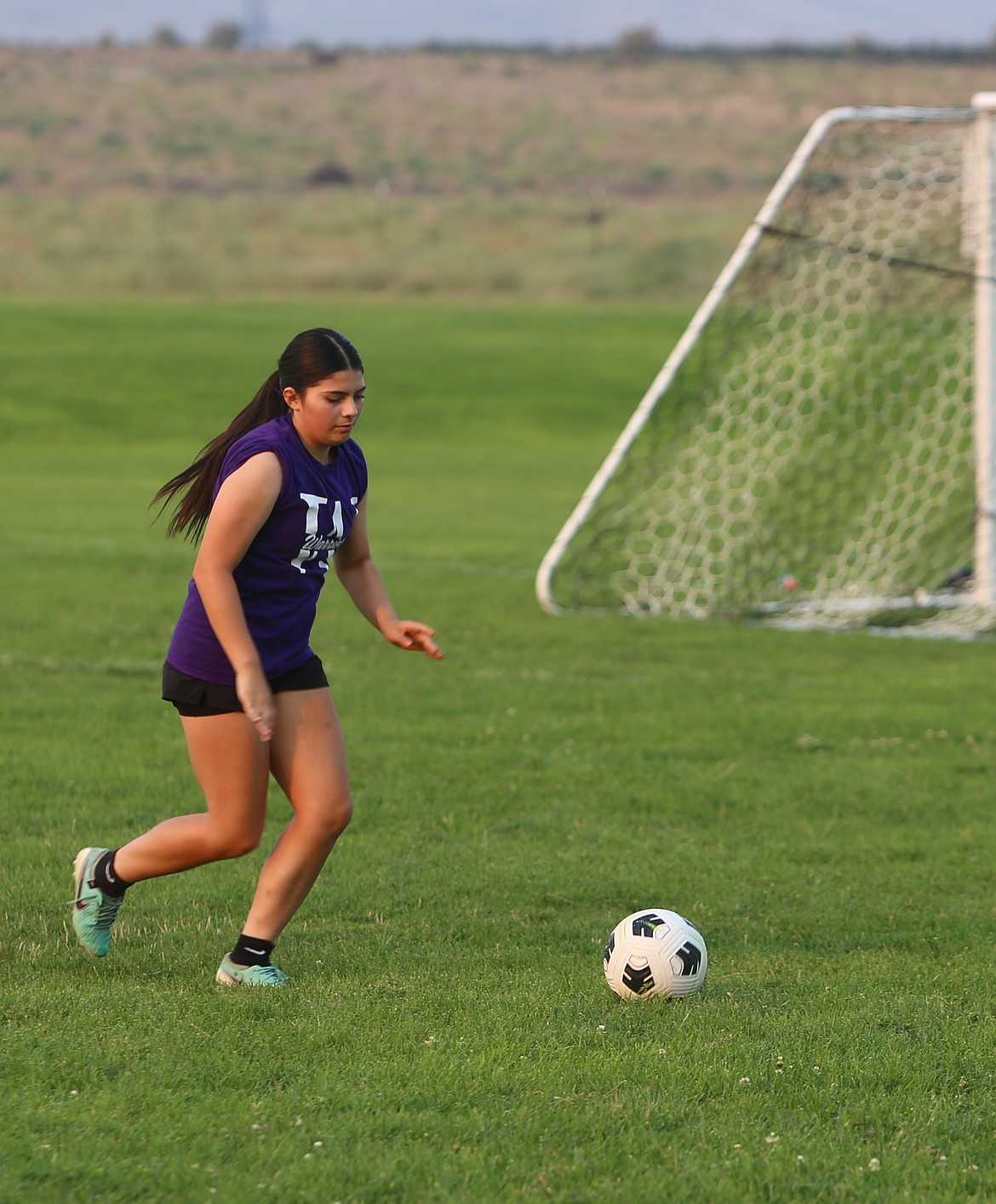 Alexandra Rodriguez runs to the ball to make a pass during a drill. Head Coach Cele Lopez said some of his players have club soccer experience which they will be able to rely on this season.