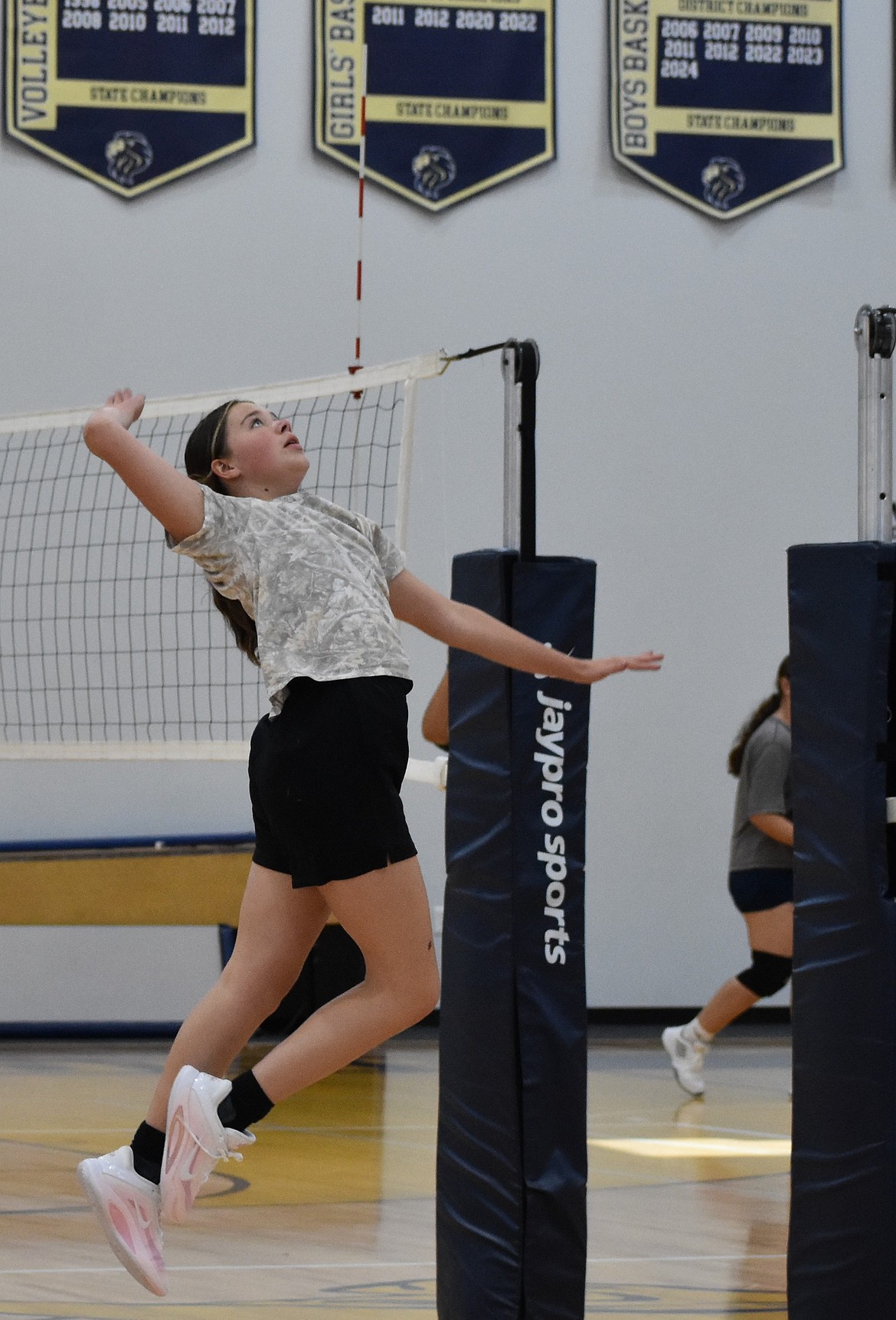 Lions player Shay Kast jumps in the air, ready to hit the ball during practice. Despite being a younger team, coach Dean Spurbeck said he has a lot of confidence in the abilities of the players.