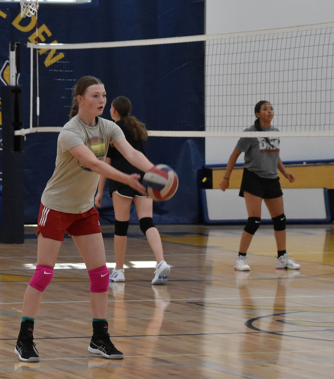 Lions Clarissa Shopbell throws the ball back to her teammate during practice. Coach Dean Spurbeck said he has seen a lot of talent from the younger players on the team since they have begun developing the players at the middle school level.