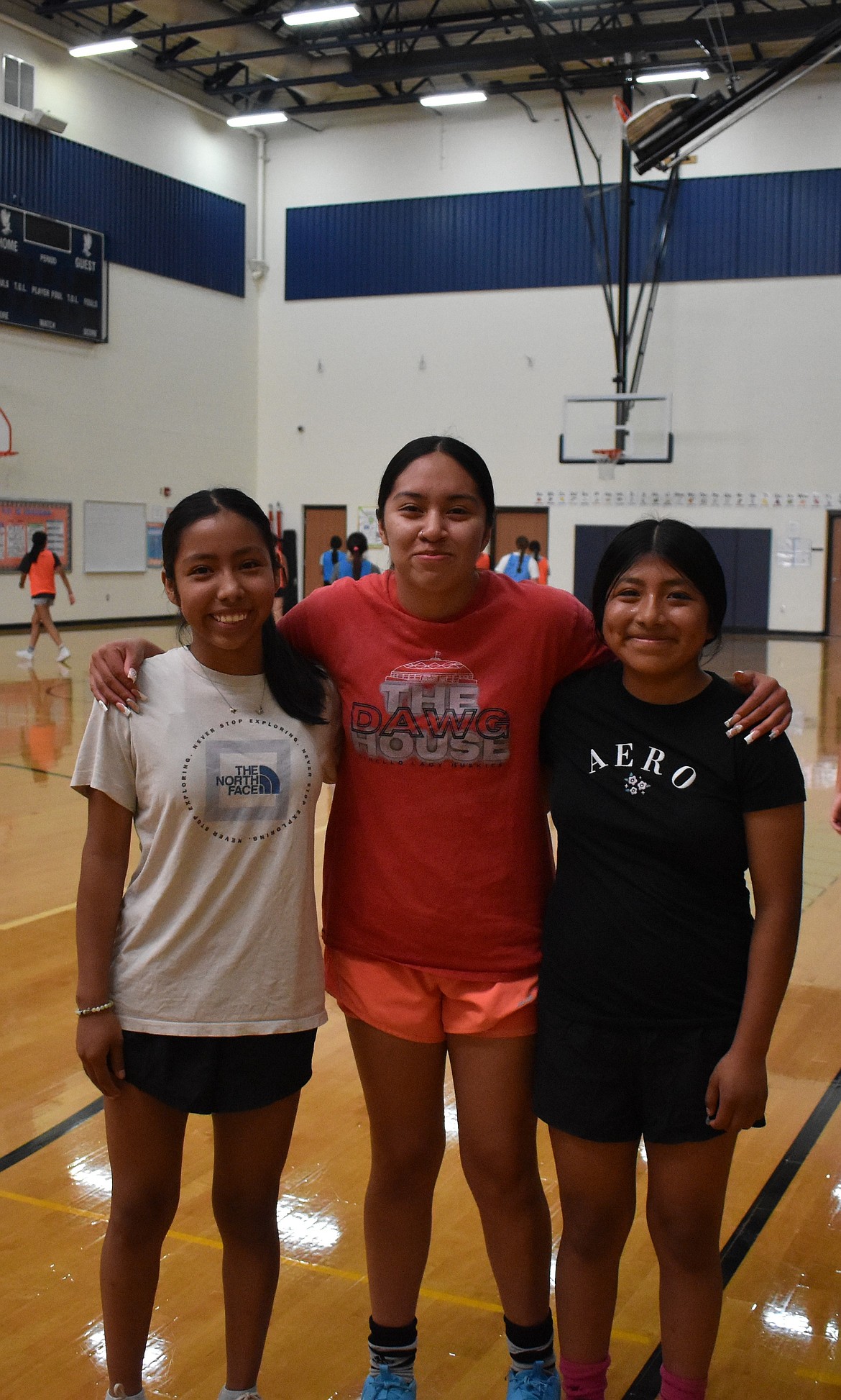 Betsy Policarpio, Miriam Garcia and Esther Lopez line up together for a photo during practice. Coach Victor Quiroz said that one of the goals this season is for the players to learn how to play together and build up team chemistry.