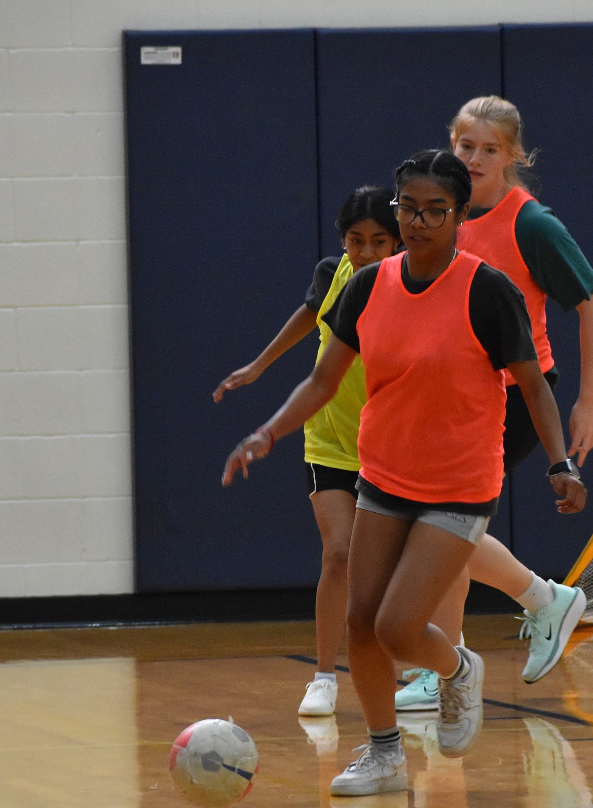 Huskies player Mili Flores readies herself to kick the ball into the goal during an indoor practice scrimmage. Coach Victor Quiroz said the team is starting the season by working on the fundamentals.