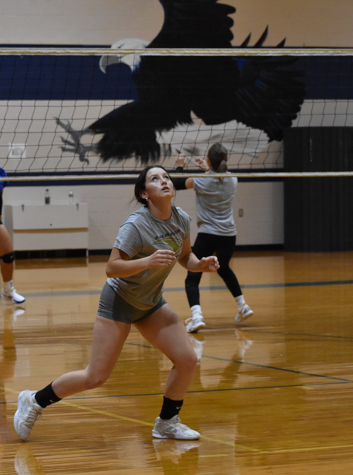 Eagles senior Mylee Dana keeps her eye on the ball during a warmup at practice. Dana said the bonds of the team, both on and off the court, are one of the team’s many strengths.