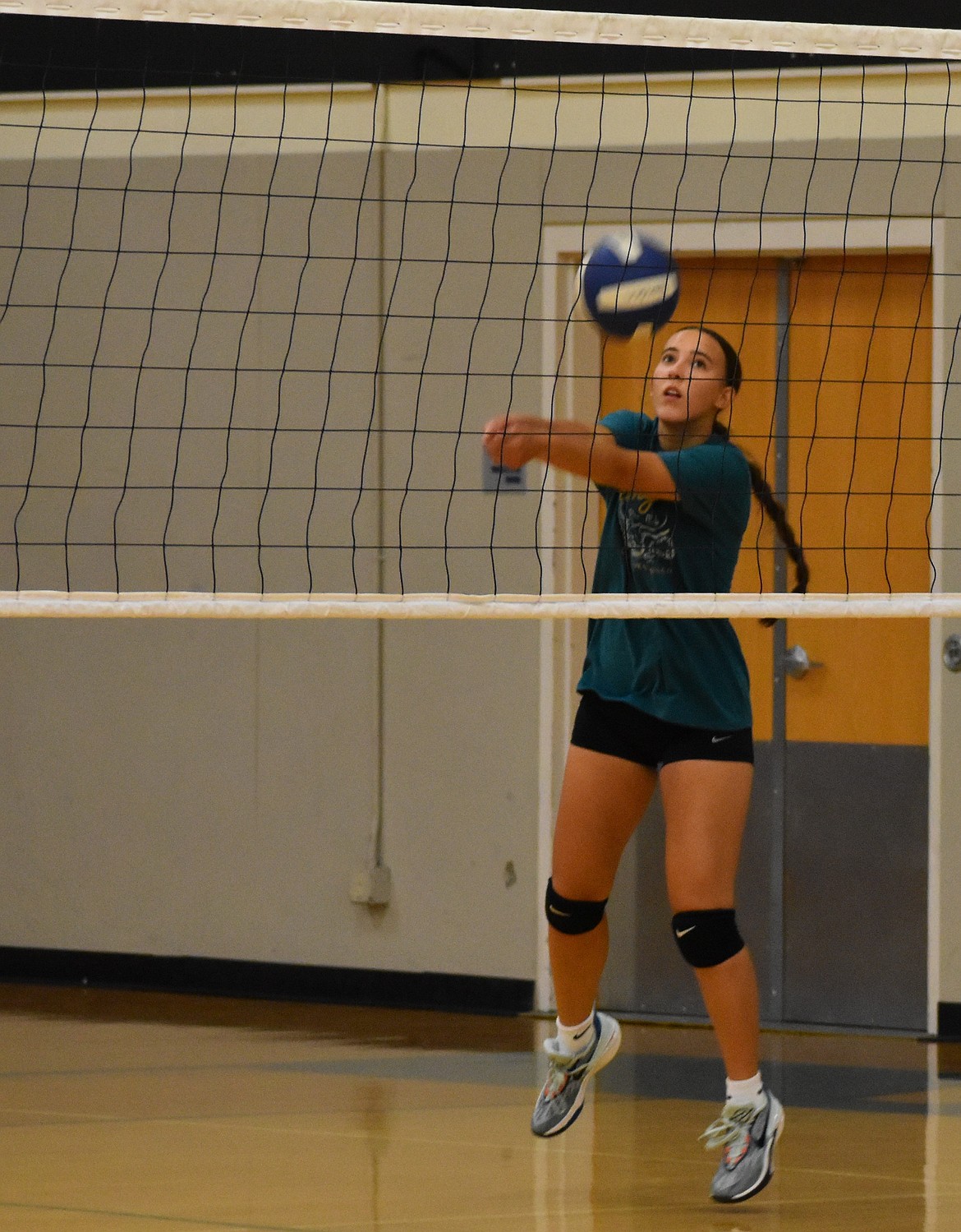 Warden senior Amaya Erickson hits the ball over the net during a training match at practice. The Cougars are returning three seniors to the squad this year with each aspiring to work together with their younger teammates.