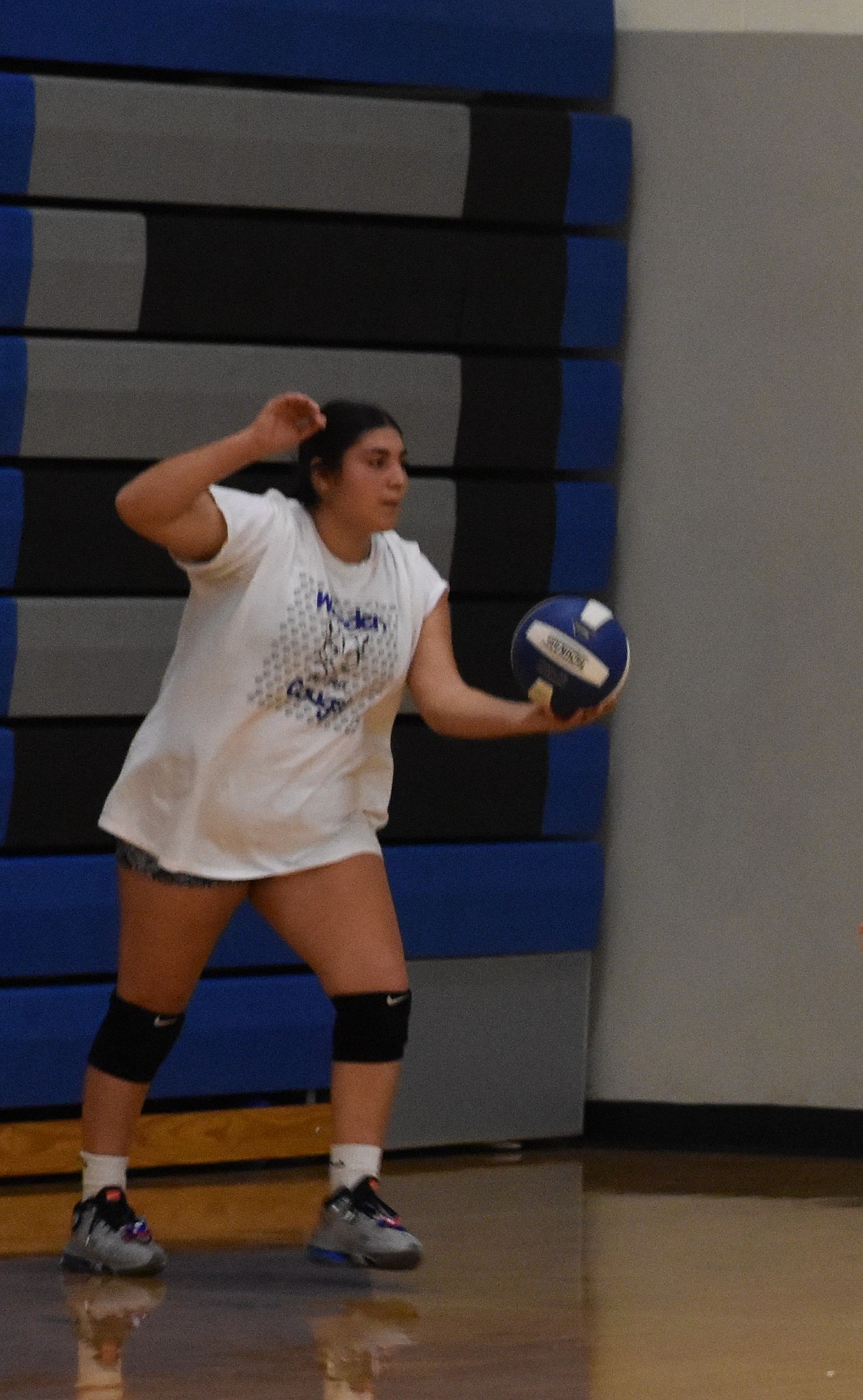 Jamylex Pruneda, one of the seniors with the Cougars this season, works on her serves during a warmup exercise at practice. Pruneda said that the efforts of the five seniors benefitted them last season and hopes to put in the same work as a senior this year.