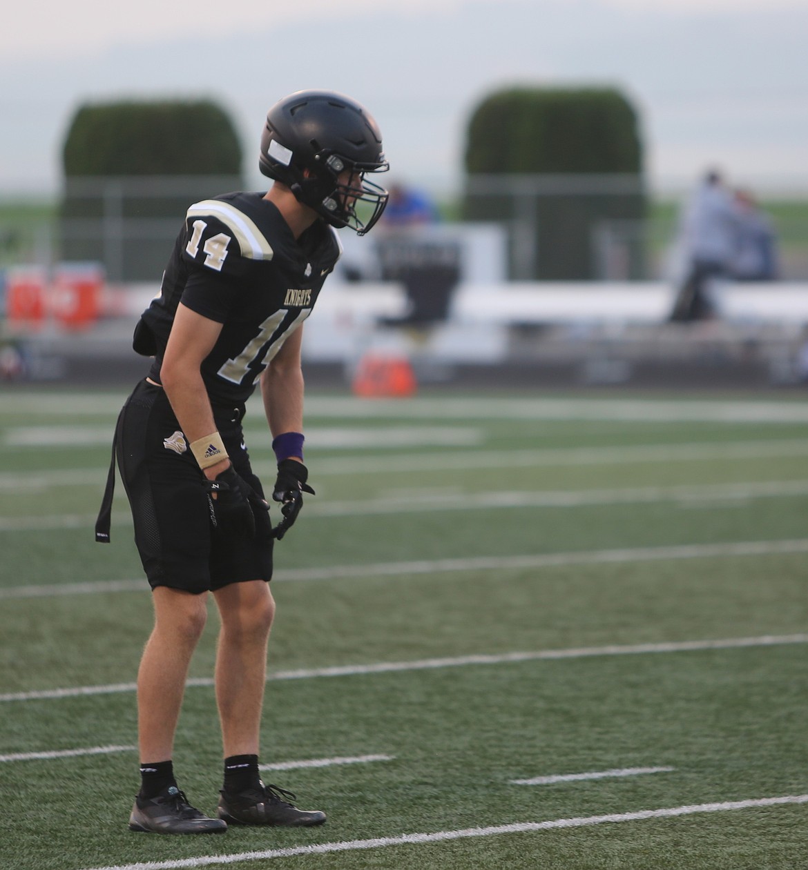 Three-way player Anderson Brown lines up on defense for the Knights. Brown has two interceptions, a receiving touchdown and several successful PATs on Friday.
