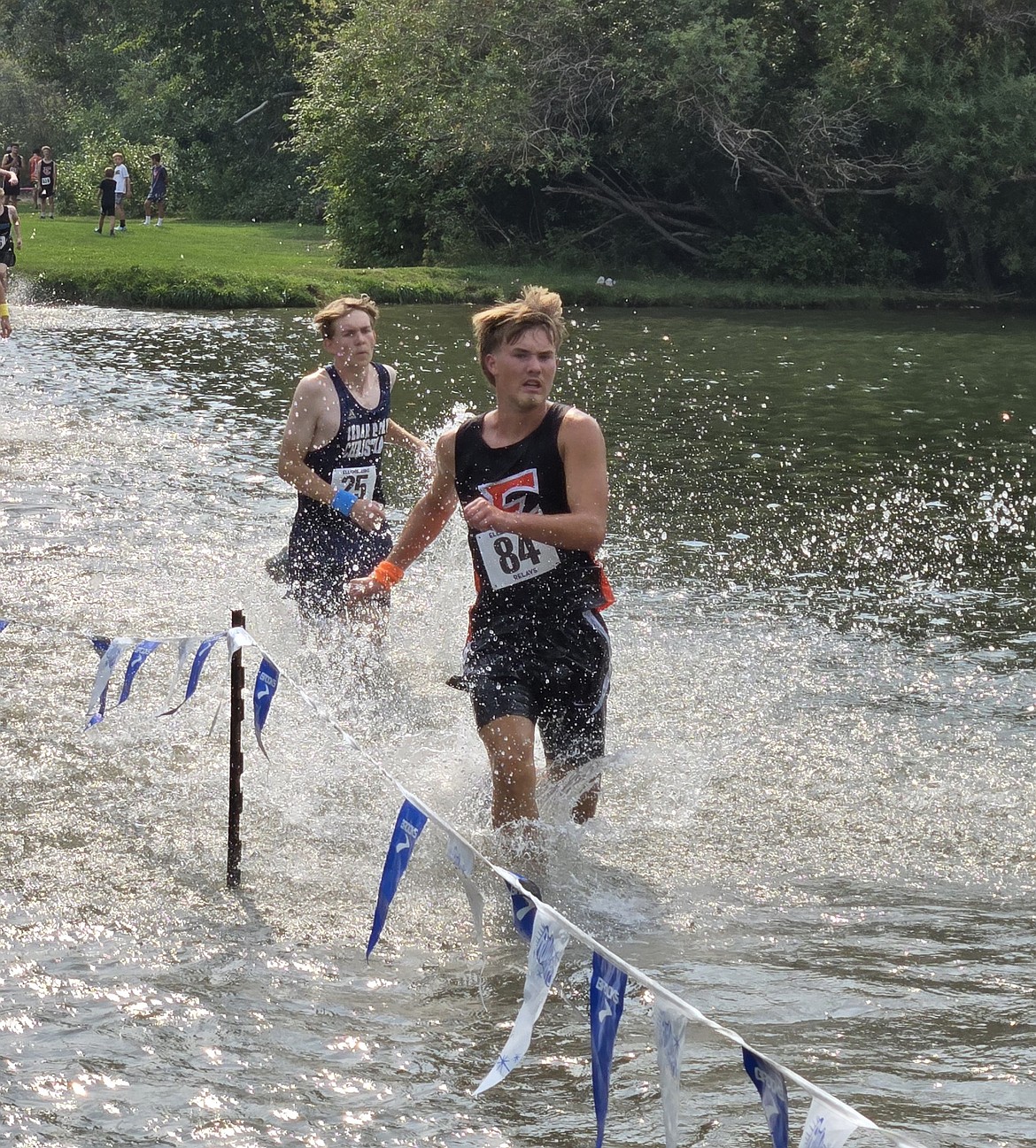 Ephrata’s Zane Sieg runs through the water segment during the Ellensburg Invitational on Saturday. Sieg earned a final relay time of 10:09.5 in the team relay event.