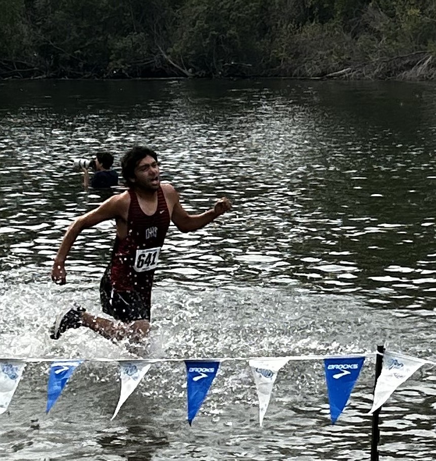 Alejandro Mendoza, Othello, at the water obstacle during the Ellensburg Invitational. Mendoza earned fourth in the individual race event Two, contributing to the team’s overall third-place finish.