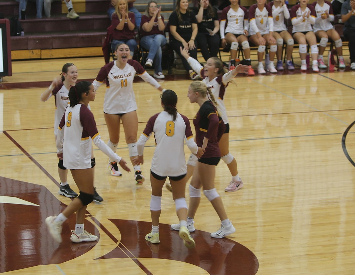 Mavs volleyball celebrates another scored point against Hermiston on Saturday. Head Coach Krystal Trammell said her team did a good job of communicating and strategizing.