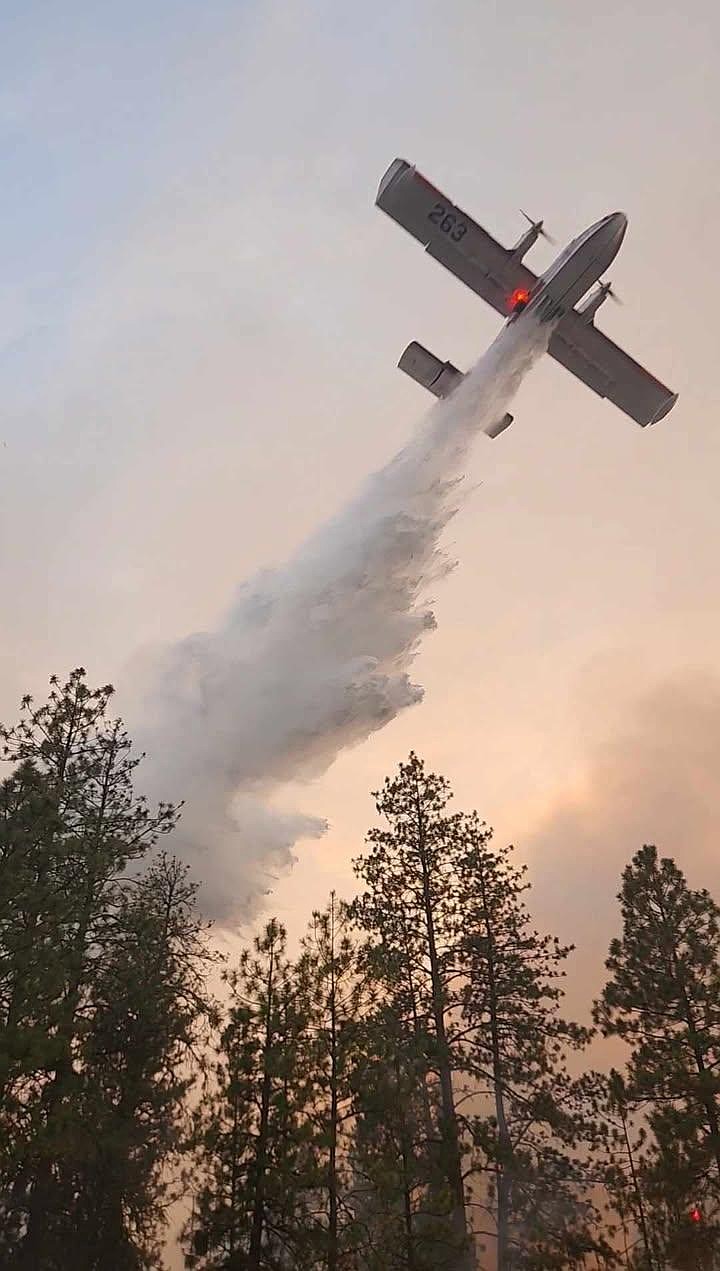 A scooper plane drops water on the north side of the Rattlesnake Fire on Sept. 7. The fire is the largest one in Washington at around 17,700 acres as of Monday with 5% containment.