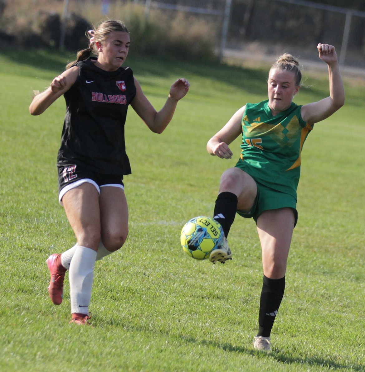 JASON ELLIOTT/Press
Lakeland sophomore Kapree Kiefer plays the ball off her foot as Sandpoint's Vivian Haag defends during the first half of Tuesday's match at Sunrise Rotary Field in Rathdrum.